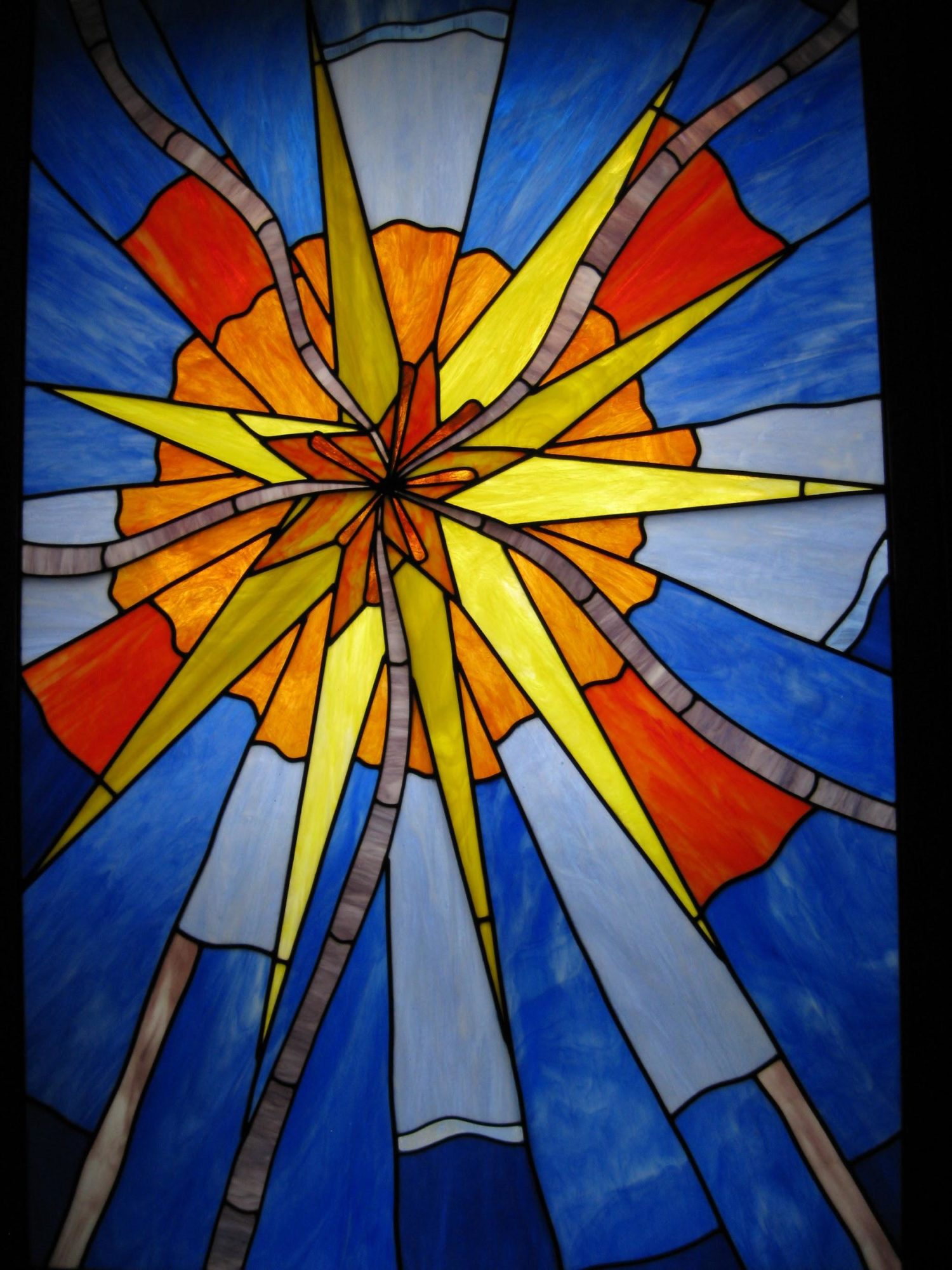Blue read and yellow stain glass star church window